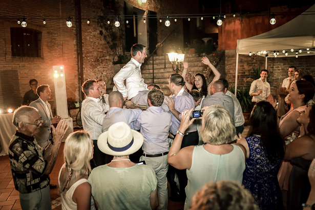 Wedding guests lifting the bride and groom | Morgan and James Real Wedding By Infinity Weddings | Confetti.co.uk