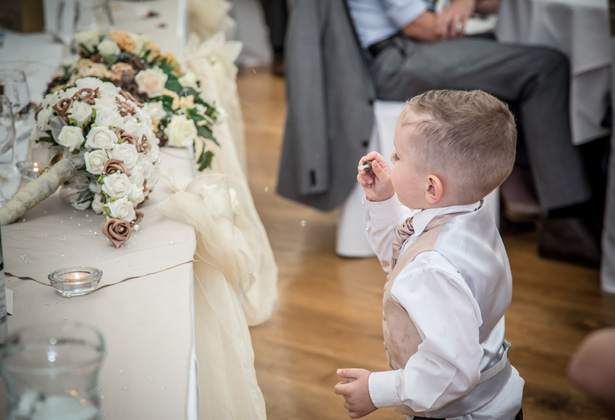 The newlyweds son blowing bubbles during the wedding speeches| Becki and Rob’s Real Wedding By Jenny Martin Photography | Confetti.co.uk