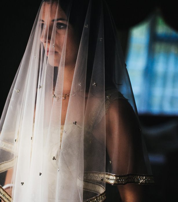 Bride in her gold wedding dress and gold veil | Francesca & Arun's Fusion Real Wedding | Confetti.co.uk  