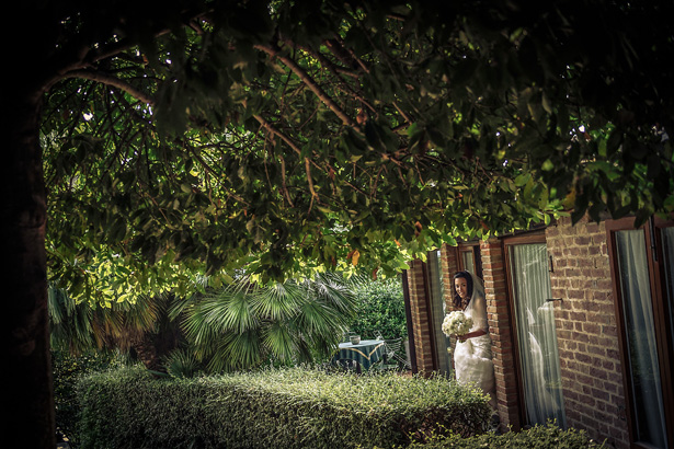 Bride on her way to the ceremony| Morgan and James Real Wedding By Infinity Weddings | Confetti.co.uk