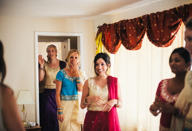 Bridesmaids in traditional Asian attire  | bridesmaids seeing the bride for the first time | Francesca & Arun's Fusion Real Wedding | Confetti.co.uk  