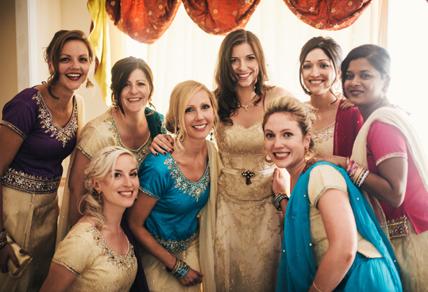 Bride in her bespoke gold wedding dress| Bridesmaids in traditional Asian wedding attire | Francesca & Arun's Fusion Real Wedding | Confetti.co.uk  