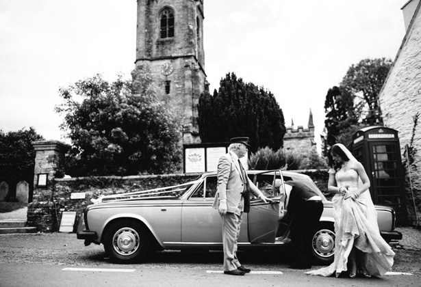 Bride, in her gold wedding dress arriving at the church in a vintage Rolls Royce| Francesca & Arun's Fusion Real Wedding | Confetti.co.uk  