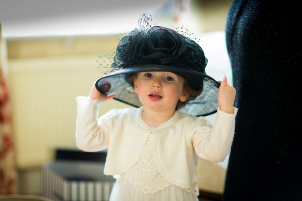 Flower girl wearing the mother of the brides hat | Abigail and Chris's Real Christmas Wedding | Confetti.co.uk 