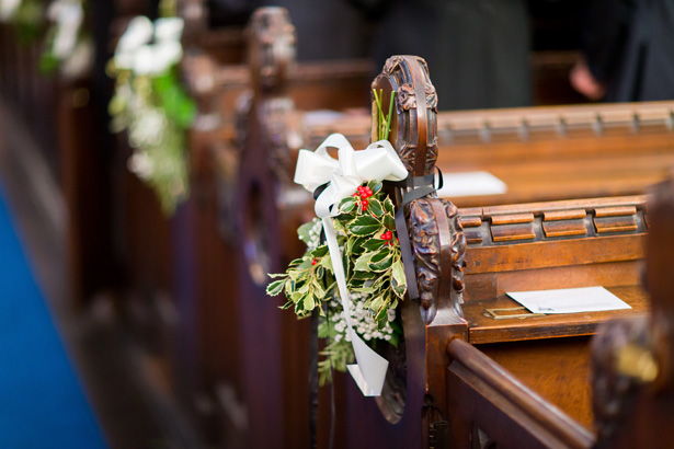 Holly leaves aisle decoration| Abigail and Chris's Real Christmas Wedding | Confetti.co.uk 