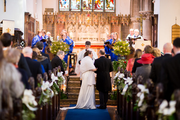 Bride and groom at the alter | Abigail and Chris's Real Christmas Wedding | Confetti.co.uk 