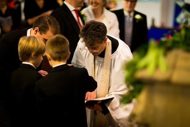 Ushers handing the rings over | Abigail and Chris's Real Christmas Wedding | Confetti.co.uk 