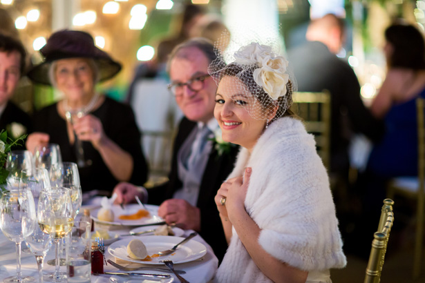 Bride enjoying the wedding breakfast | Abigail and Chris's Real Christmas Wedding | Confetti.co.uk 