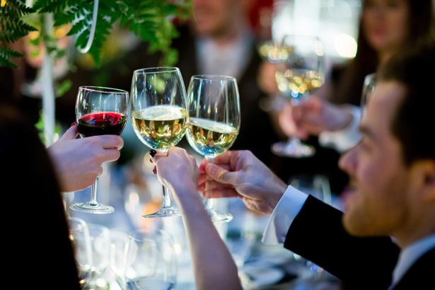 Wedding guests toasting the marriage | Abigail and Chris's Real Christmas Wedding | Confetti.co.uk 