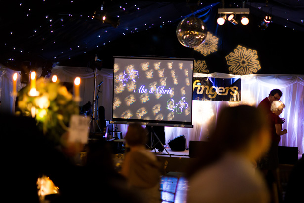 Personalised projector screen with Mr and Mrs | Abigail and Chris's Real Christmas Wedding | Confetti.co.uk 