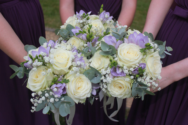 White rose and purple bridesmaid bouquets| Purple themed wedding| Rhiannon & Michael's Real Wedding | Confetti.co.uk