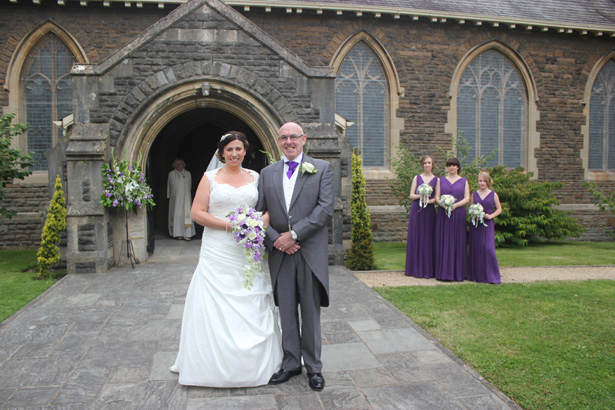 Bride with her father outside Radyr Christ Church| Purple themed wedding| Rhiannon & Michael's Real Wedding | Confetti.co.uk