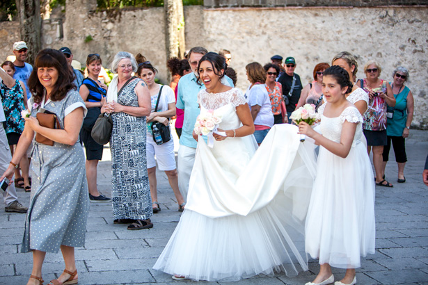 The bride and her bridesmaids walking through the town of Ravello, Italy | Leanne and Chris's Real Italian Wedding | Confetti.co.uk