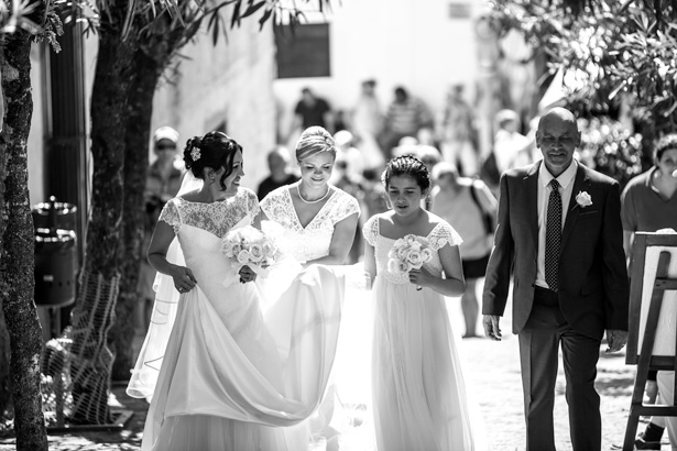 The bride and her bridesmaids walking through the town of Ravello, Italy | Leanne and Chris's Real Italian Wedding | Confetti.co.uk