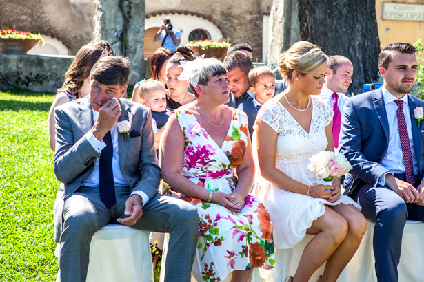 Emotional wedding guests  at the ceremony in Ravello, Italy | Outside wedding ceremony ideas | Leanne and Chris's Real Italian Wedding | Confetti.co.uk