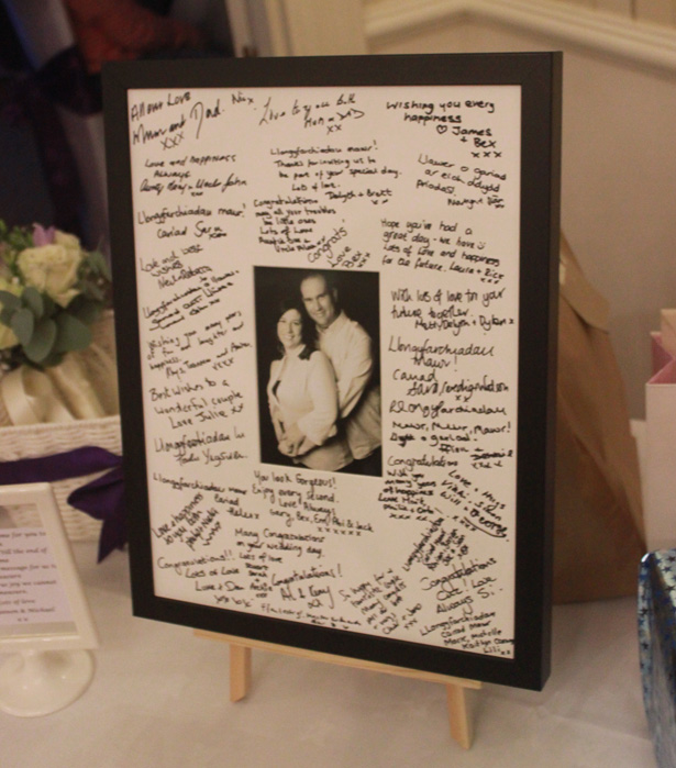 Personalised signing frame signed by wedding guests| Purple themed wedding| Rhiannon & Michael's Real Wedding | Confetti.co.uk