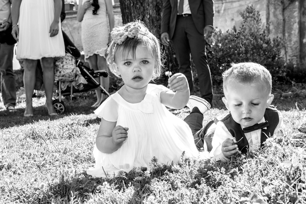 Younger wedding guests playing on the grass | Wedding moments you have to capture | Leanne and Chris's Real Italian Wedding | Confetti.co.uk