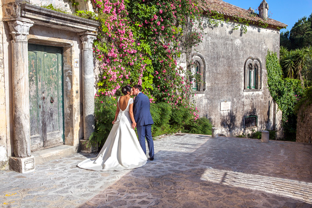 Official wedding shoot by Debbie Sanderson Wedding Photography| Bride and groom kissing on the staircase at Ravello, Italy | Wedding moments you have to capture | Leanne and Chris's Real Italian Wedding | Confetti.co.uk 