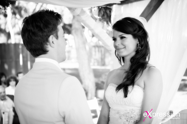 Bride and groom at holding hands |Wedding ceremony at the Sheraton Algarve Hotel, in the Algarve, Portugal.| Debora and James’s real destination wedding | Confetti.co.uk