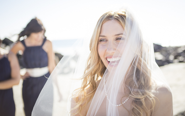 Bride laughing with her bridesmaids on the California beach| Crystal & Giampaolo California Real Wedding |Destination Wedding America | Confetti.co.uk 