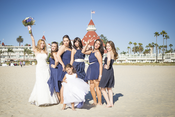 Bride with her bridesmaids and the flower girl on the beach | Funny wedding poses | Crystal & Giampaolo California Real Wedding |Destination Wedding America | Confetti.co.uk 