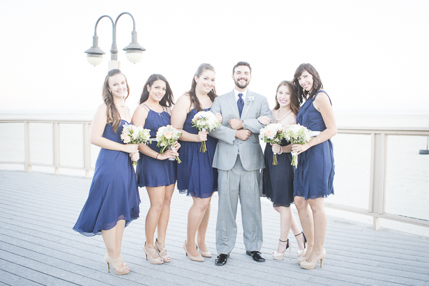 The groom with the bridesmaids on the pier | Beach wedding | Crystal & Giampaolo California Real Wedding |Destination Wedding | Confetti.co.uk 