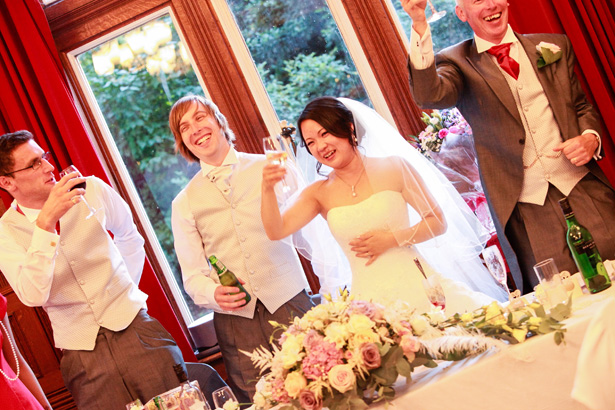 Bride and groom along with their guests toasting their marriage | Shasha and James real wedding | 1920’s Great Gatsby Wedding Confetti.co.uk 