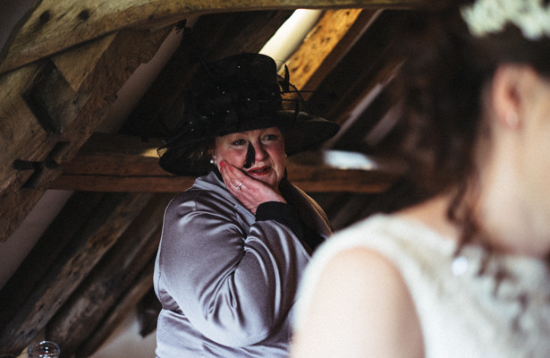 Emotional mother of the bride watching the bride get ready | Steph and Gary's Real Garden Wedding | Confetti.co.uk 