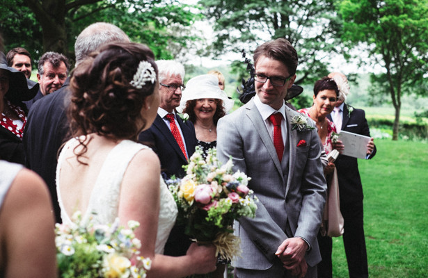 The bride and groom at together for their garden wedding ceremony | Garden wedding ideas | Steph and Gary's Real Garden Wedding | Confetti.co.uk 