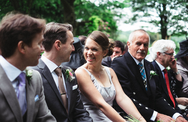 Wedding guests enjoying the garden ceremony | Garden wedding ideas | Steph and Gary's Real Garden Wedding | Confetti.co.uk 