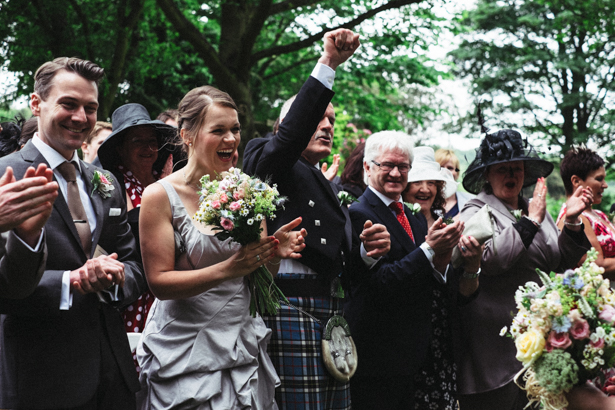 Wedding guests celebrating the marriage| Garden wedding ideas | Steph and Gary's Real Garden Wedding | Confetti.co.uk 