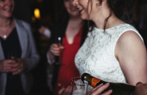 Bride and guests enjoying champagne during the cocktail hour| Steph and Gary's Real Garden Wedding | Confetti.co.uk 