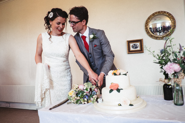 Bride and groom cutting their 2 tiered wedding cake | Vintage wedding ideas | Steph and Gary's Real Garden Wedding | Confetti.co.uk 