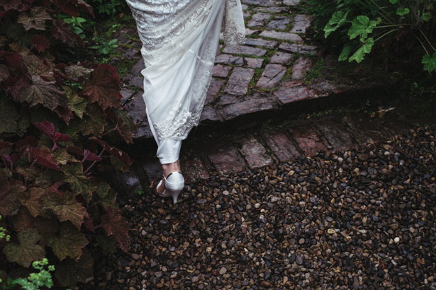 The bride walking through the garden | Vintage wedding ideas | Steph and Gary's Real Garden Wedding | Confetti.co.uk 