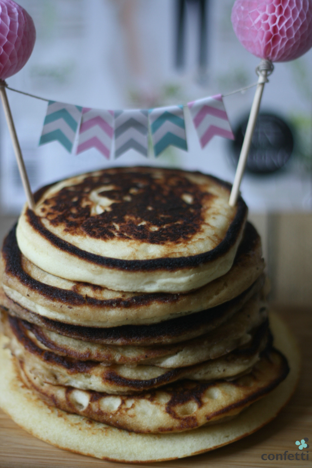 A stack of pancakes with Confetti.co.uk's Chevron Bunting Cake Topper