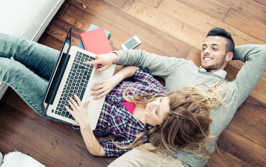 couple using a laptop together