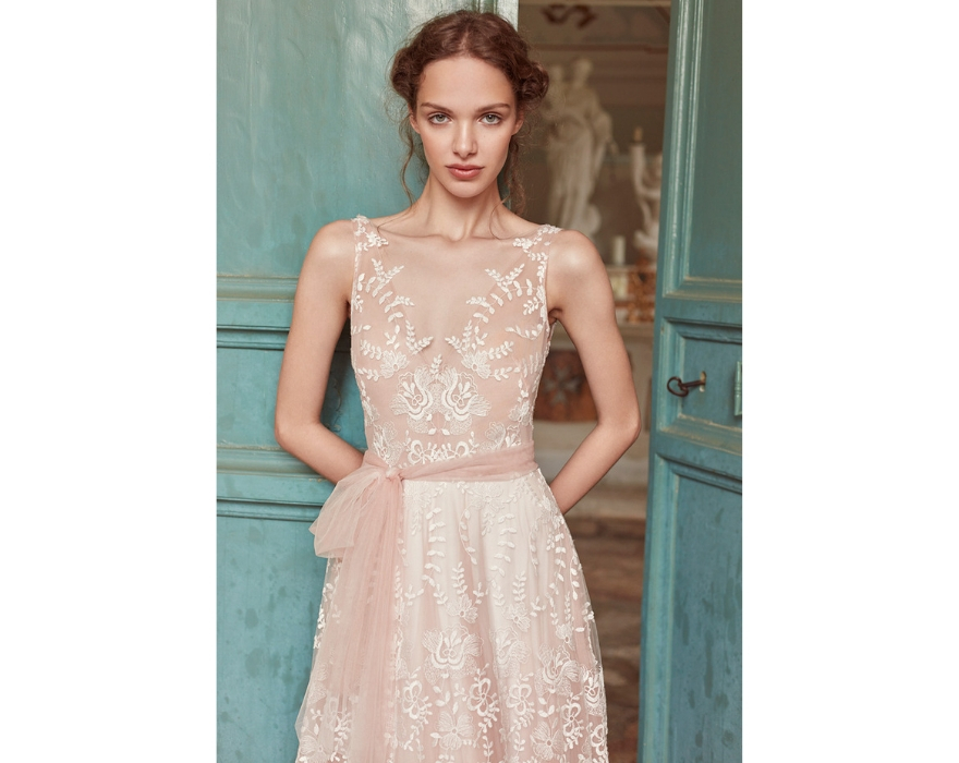 Lace wedding dress with pink sash