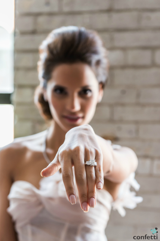 Bride showing her engagement ring | Confetti.co.uk