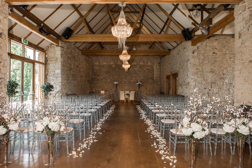 Flower Petal Lined Wedding Aisle at The Monks' Refectory at Notley Abbey Wedding Venue in Buckinghamshire - Bijou Wedding Venues - Beautiful Wedding Aisle Inspiration | Confetti.co.uk