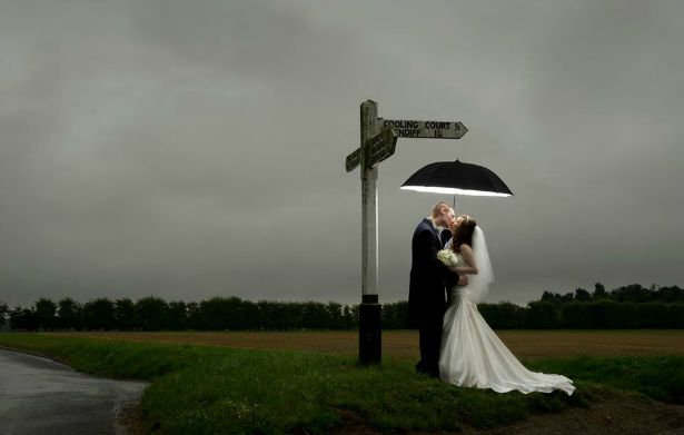 Umbrella in the rain at crossroads by Halo and Hobby | Confetti.co.uk