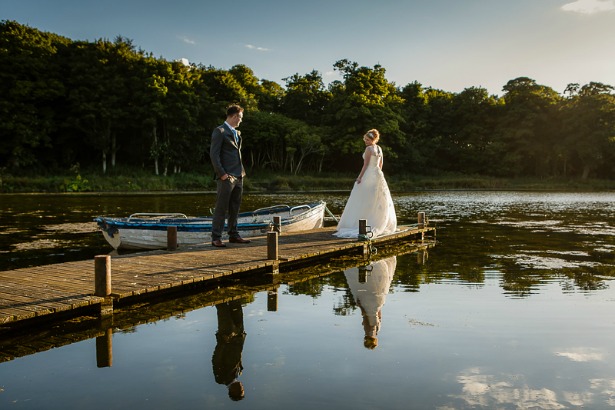 Bride and groom by boating lake by GWS Photography | Confetti.co.uk