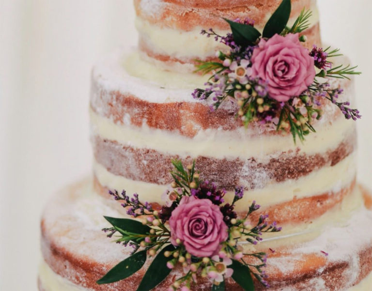 Semi Naked Wedding Cake with Beautiful Flowers and Roses | Confetti.co.uk