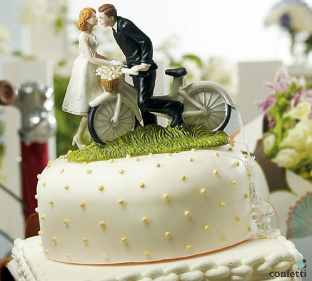 A kiss above bicycle cake topper | Confetti.co.uk