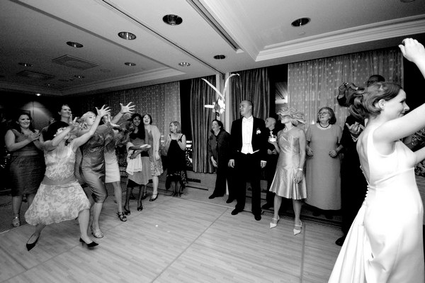 Tossing the bouquet at the wedding | Confetti.co.uk