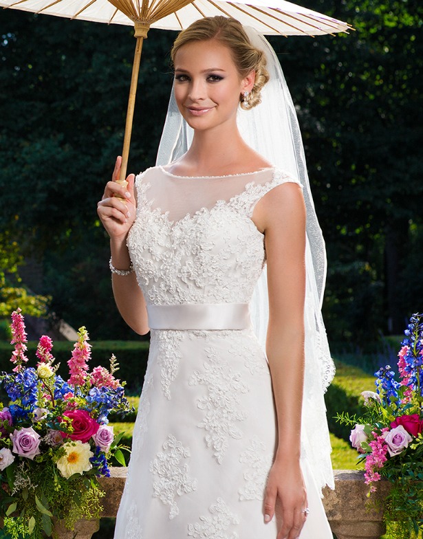 Sincerity Bridal wedding dress on bride with parasol umbrella | Confetti.co.uk