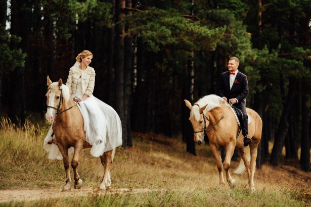 Horse riding couple on Honeymoon in Greece by Tinggly | Confetti.co.uk