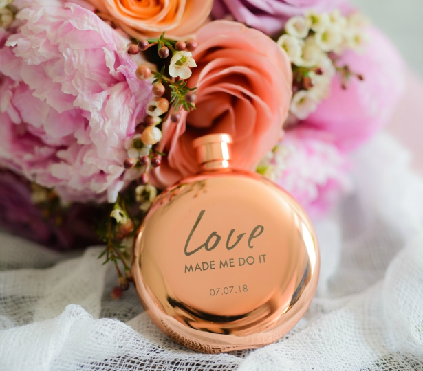 Polished Rose Gold Hip Flask With "Love Made Me Do It" Etched Into The Flask by Confetti.co.uk