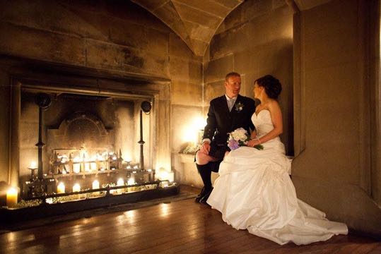 Bride and groom by the open fire at Ackergill Castle Scotland | Confetti.co.uk