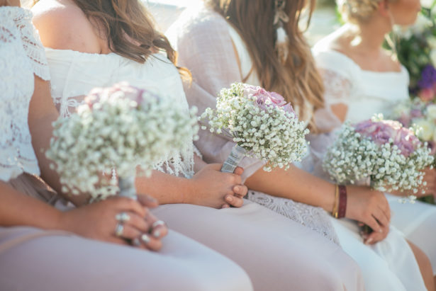 Bridesmaids holding bouquets by Ibiza Flower Shop | Confetti.co.uk