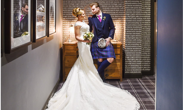 Bride and Groom share a loving look at The Village Hotel Edinburgh | Confetti.co.uk